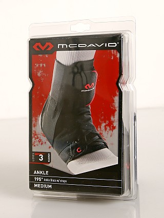 Model in black McDavid Sports Medicine Ankle Brace with Straps