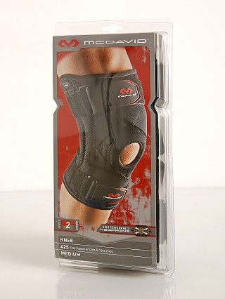 Model in black McDavid Sports Medicine Knee Support w/ Stays & Straps