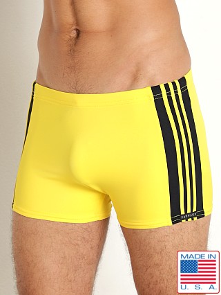 Model in yellow/black Sauvage Freestyle Nylon Lycra Swim Trunk