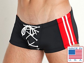 Model in black/red LASC Scrimmage Lace Up Swim Trunk