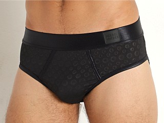 Model in black Modus Vivendi All Gender Embossed Dot Brief