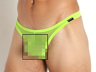 Model in citrus green Cocksox Italian Mesh Enhancer Thong