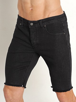 Model in black Nasty Pig NP Cut Off Shorts