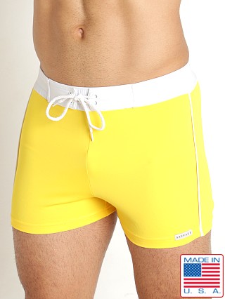 Model in yellow Sauvage Retro Nylon/Lycra Swim Short