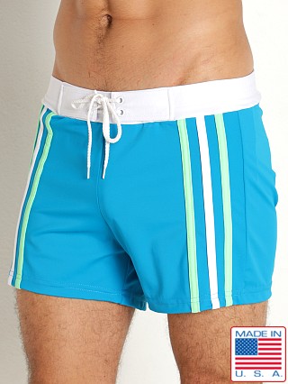 Model in teal Sauvage Side Striped Swim Trunk