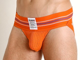 Model in orange Cell Block 13 Tight End Jockstrap