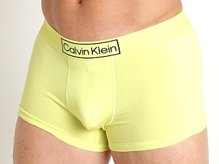 Model in cyber green Calvin Klein Reimagined Heritage Trunk