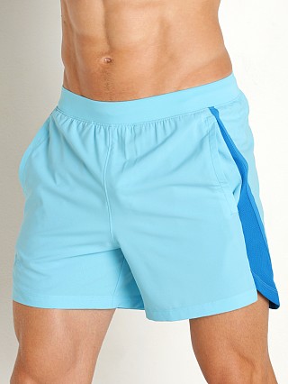 Model in fresco blue/reflective Under Armour Launch 5" Running Short