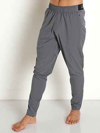 Model in pitch gray/black Under Armour Ripstop Woven Pants