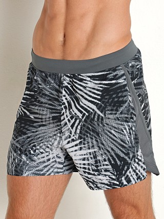 Model in pitch gray/reflective Under Armour Launch 5" Running Short