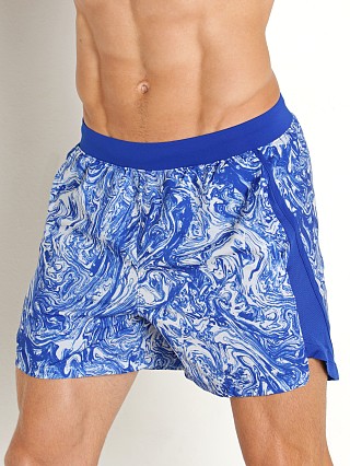 Model in royal/reflective Under Armour Launch 5" Running Short