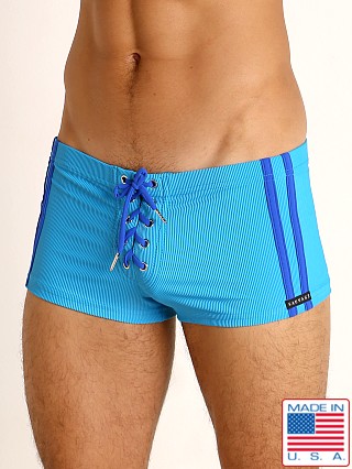 Model in royal/cobalt Sauvage Football Lace-up Swim Trunk