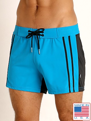 Model in teal/black Sauvage Moderno Two-Tone Swim Short