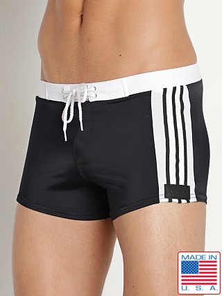 Model in black Sauvage Riviera Square Cut Swim Trunk