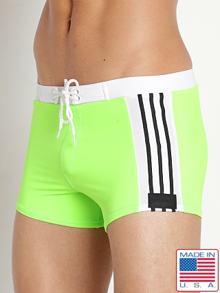 Model in fluo lime Sauvage Riviera Square Cut Swim Trunk