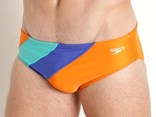 Model in persimmon orange Speedo Color Block One Swim Brief