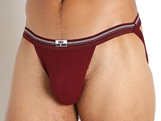 Model in burgundy Cell Block 13 Tight End Swimmer Jockstrap