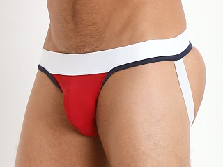 Model in red/navy/white Tulio Slinky Power Pouch 3-Way Jock Thong