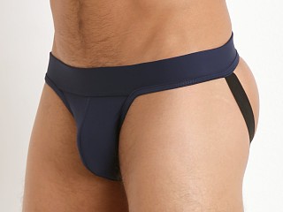 Model in navy Tulio Slinky Power Pouch 3-Way Jock Thong