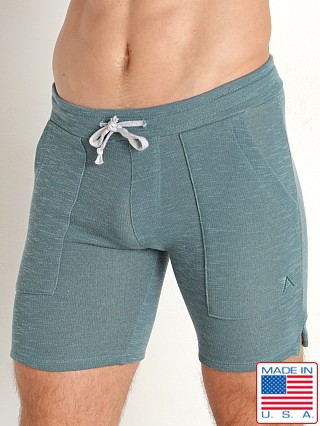 Model in teal LASC Classic Terry 7" Workout Shorts