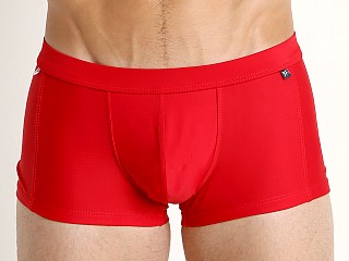 Model in red Tulio Solid C-Ring Swim Trunk