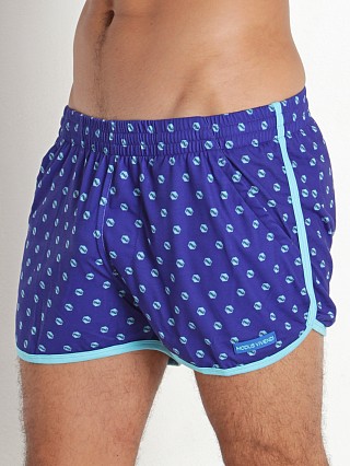 Model in blue Modus Vivendi Screw Dot Shorts