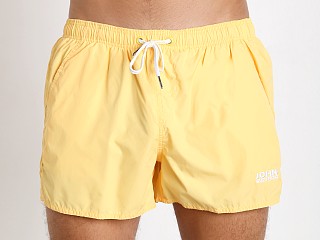 Model in yellow John Sievers Natural Pouch Swim Shorts