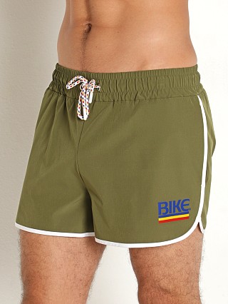 Model in olive Bike Athletic 4-Way Stretch Track Short