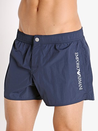 Model in navy blue Emporio Armani Embroidery Logo Swim Shorts