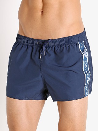 Model in navy blue Emporio Armani Bold Logo Tape Swim Shorts