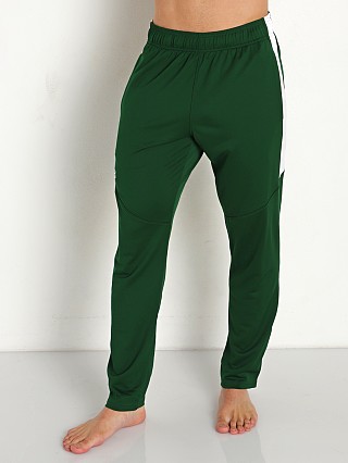 Model in forest green/white Under Armour Rival Knit Pant