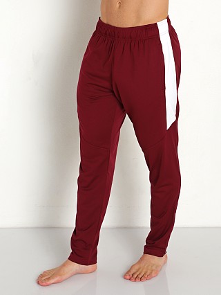 Model in maroon/white Under Armour Rival Knit Pant