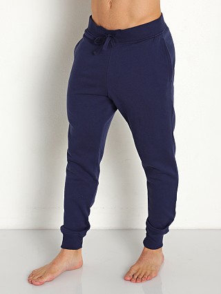 Model in midnight navy/onyx white Under Armour Rival Cotton Joggers