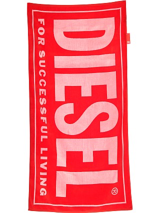 Model in red Diesel Helleri Beach Towel