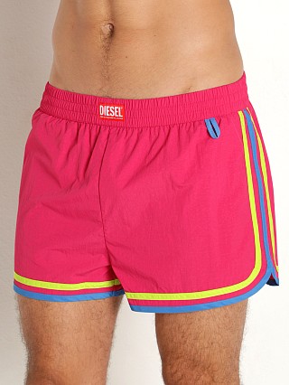 Model in passion pink Diesel Reef-30 Swim Shorts