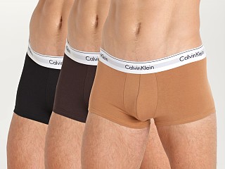 Model in black/woodland/warm bronze Calvin Klein Modern Cotton Stretch Naturals Low Rise Trunk 3-Pk