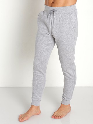 Model in gray heather/black Under Armour Hustle Fleece Jogging Pants