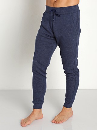 Model in navy heather/white Under Armour Hustle Fleece Jogging Pants