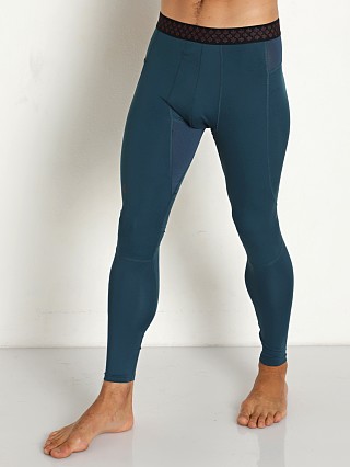 Model in blue note/black Under Armour Rush ColdGear Leggings