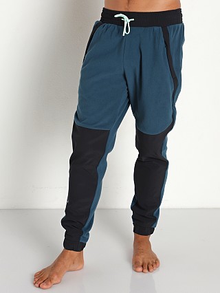 Model in blue note/aqua foam Under Armour Rush Fleece Pants