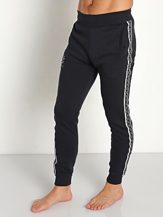 Model in black/white/concrete Under Armour Curry Fleece Jogging Pants