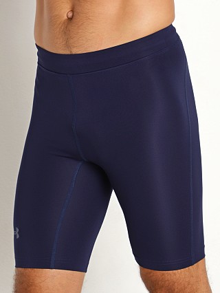 Model in midnight navy/reflective Under Armour Fly Fast 1/2 Tights