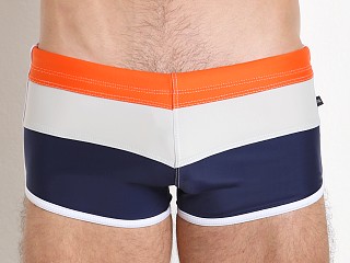 Model in navy/cement/acid orange Tulio Horizontal Retro Swim Trunk Navy/Cement/Acid Orang