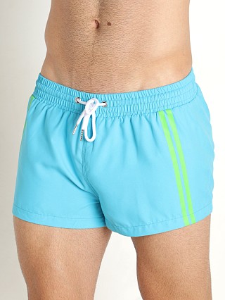 Model in aqua Nasty Pig Reveal Swim Short