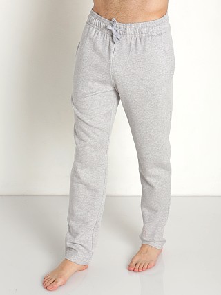 Model in mod gray heather Under Armour Rival Fleece Pants