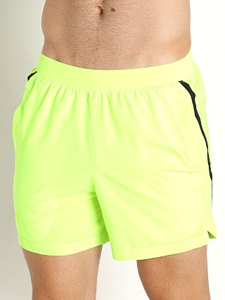 Model in lime Under Armour Launch 5" Running Short