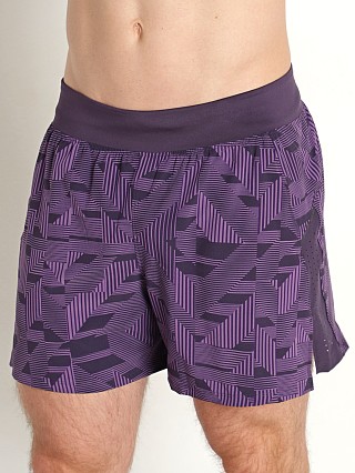 Model in retro purple/reflective Under Armour Launch Elite 5'' Short