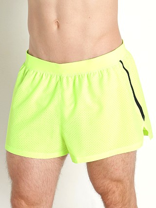 Model in lime surge Under Armour Launch Split Performance Short