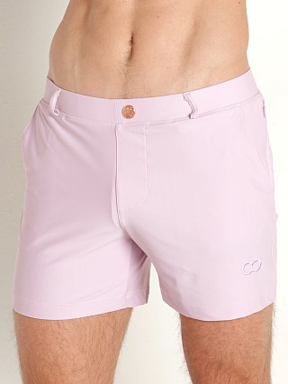 Model in pastel pink 2EROS Bondi Swim Shorts