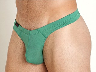 Model in abundant green Jack Adams Modal Bikini Thong